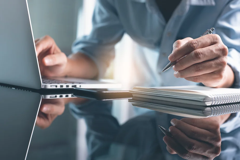 Man writing on desk